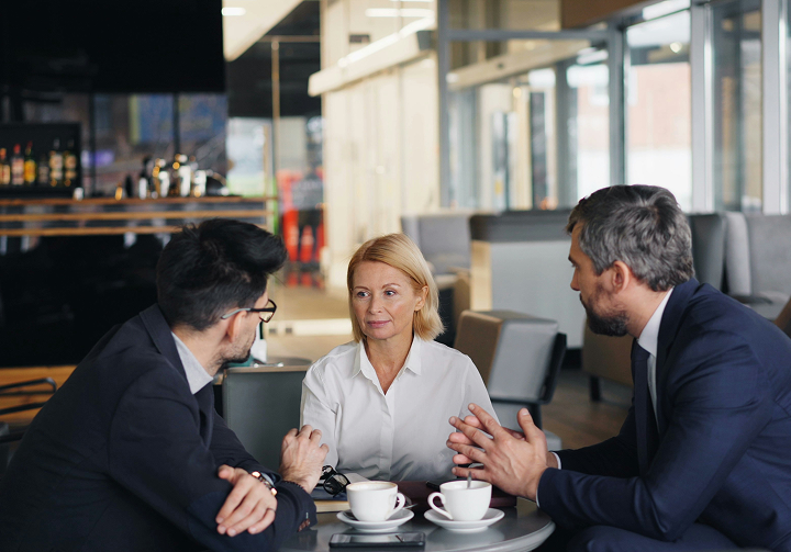 Professional business meeting discussing cybersecurity assessment